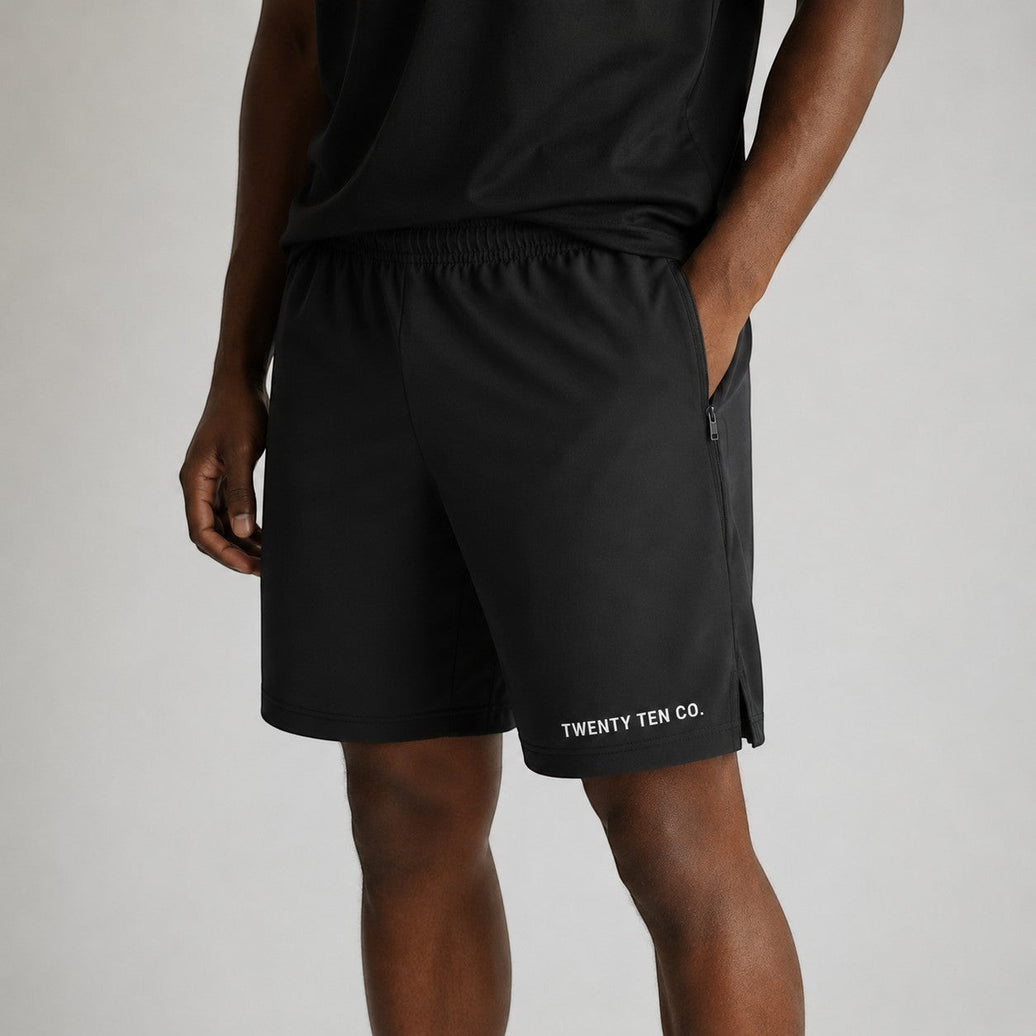 Twenty Ten Co. black athletic performance shorts with zippered pockets and elastic waistband.
