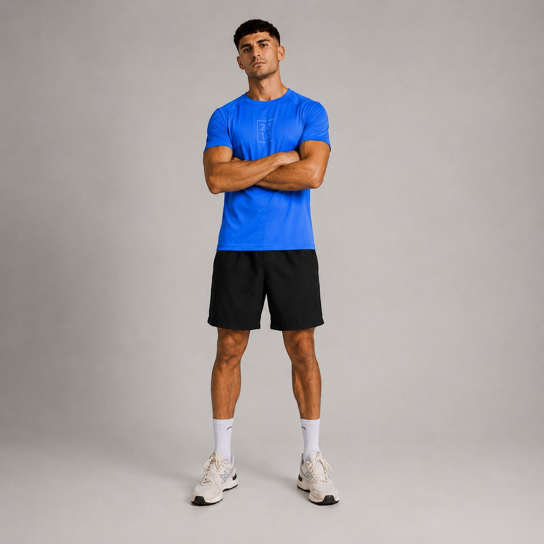 TwentyTenCollective men's sapphire blue athletic t-shirt with raglan sleeves and tonal chest logo.