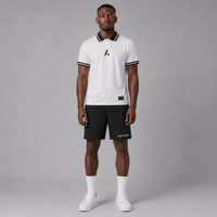 Man wearing a white and black sports outfit with a logo on a gray background