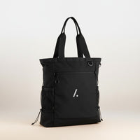 Black tote bag with a minimalist design on a light background