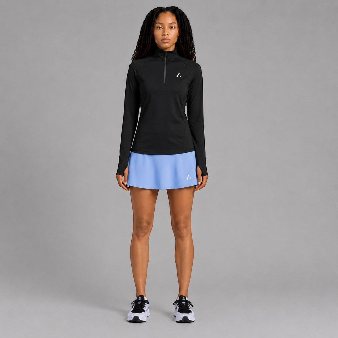 Twenty Ten Co. athletic skort in sky blue with built-in shorts and a side pocket. Features a flattering flowy skirt and elastic waistband.