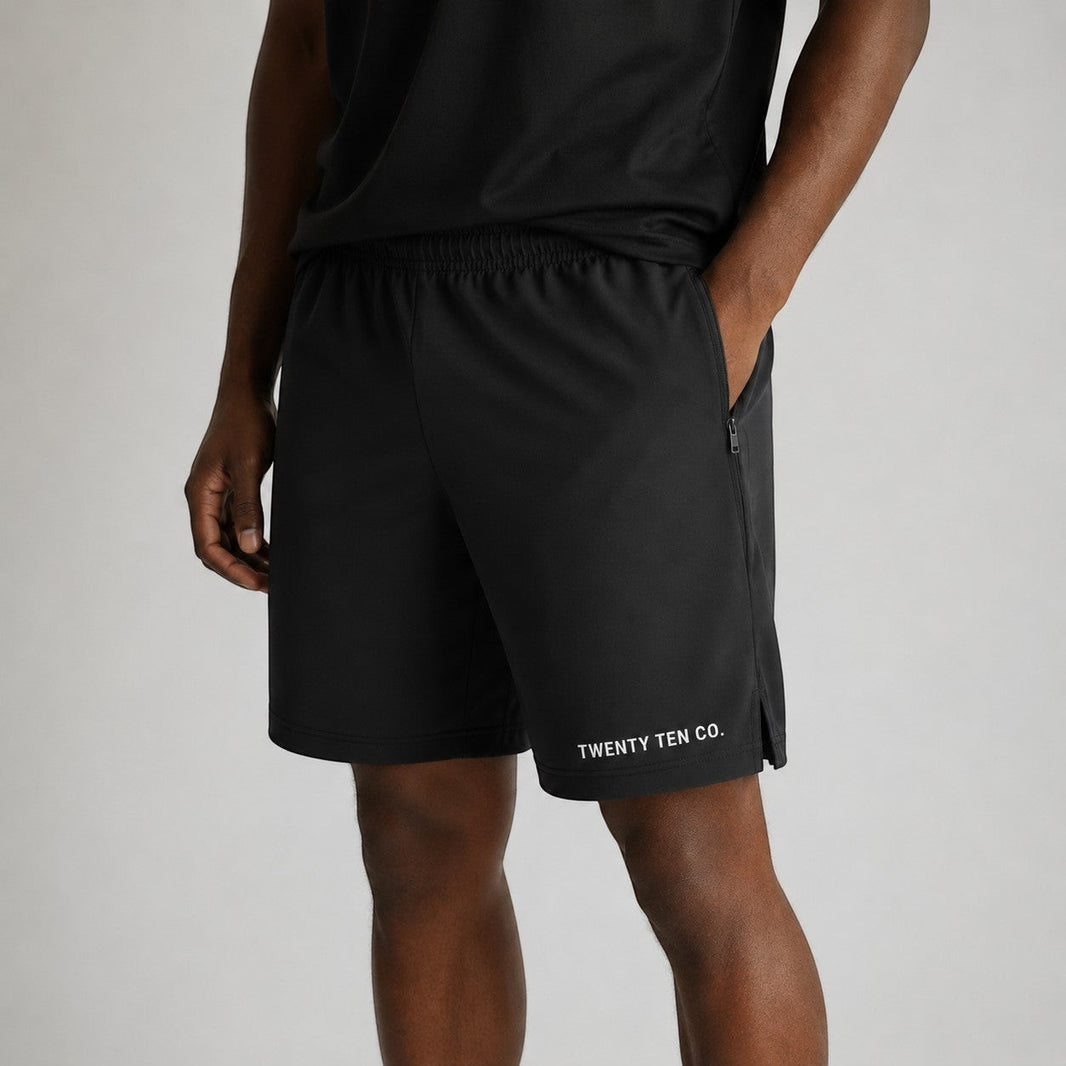 Twenty Ten Co. black athletic performance shorts with zippered pockets and elastic waistband.