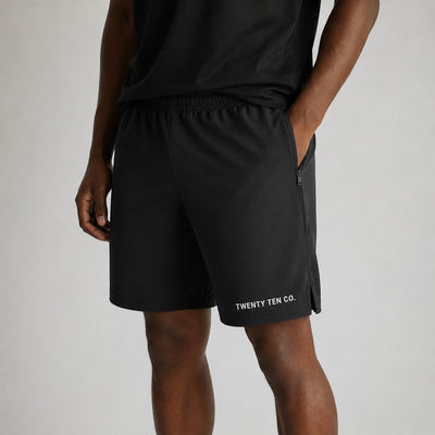 Twenty Ten Co. black athletic performance shorts with zippered pockets and elastic waistband.