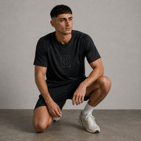 TwentyTenCollective black athletic t-shirt with raglan sleeves and tonal '20 10' chest logo. Lightweight, breathable fabric.