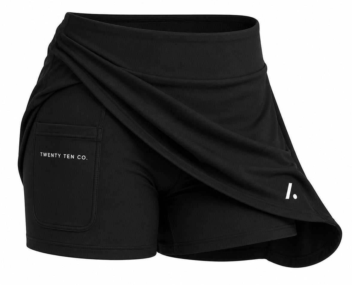 TwentyTenCollective black athletic skort with built-in shorts and pocket detail.
