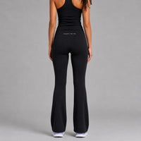 TwentyTenCollective black flared leggings made from recycled polyester and elastane, featuring a hidden waistband pocket.