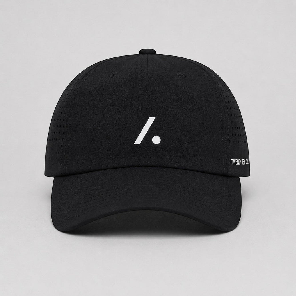 TwentyTenCollective black performance baseball cap with white logo and perforated sides for ventilation.