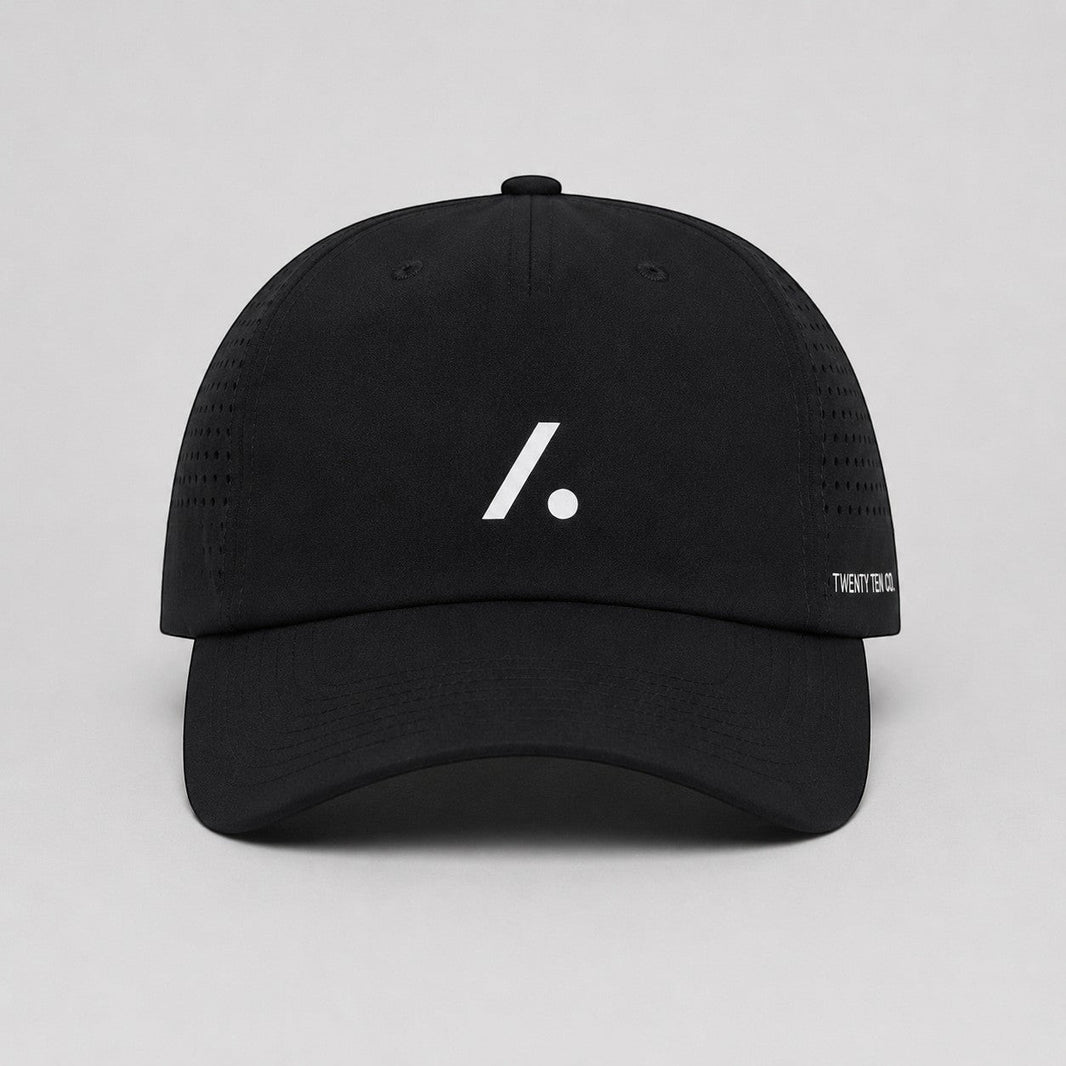 TwentyTenCollective black performance baseball cap with white logo and perforated sides for ventilation.