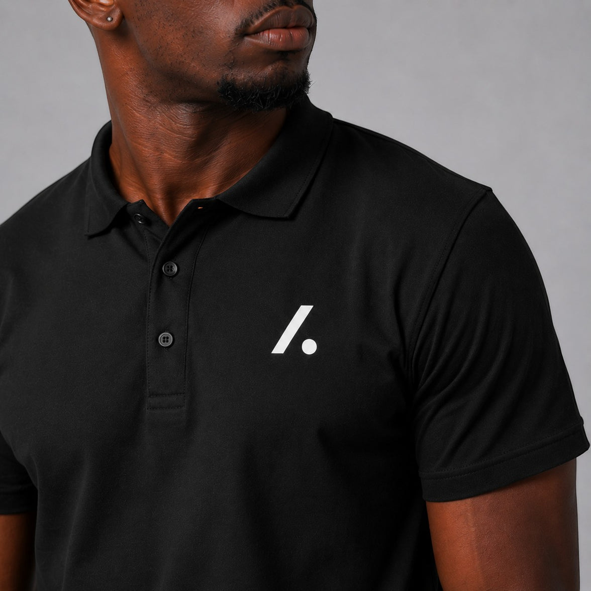 TwentyTenCollective black short sleeve polo shirt with white logo on chest, ribbed collar, and two-button placket.