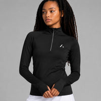 TwentyTenCollective black long-sleeve athletic top with quarter zip and thumbholes. Moisture-wicking fabric.