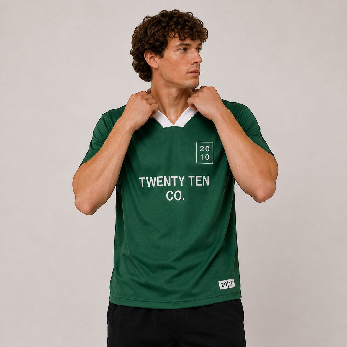 TwentyTenCollective green athletic jersey with white collar and logo, featuring breathable fabric for performance and style.