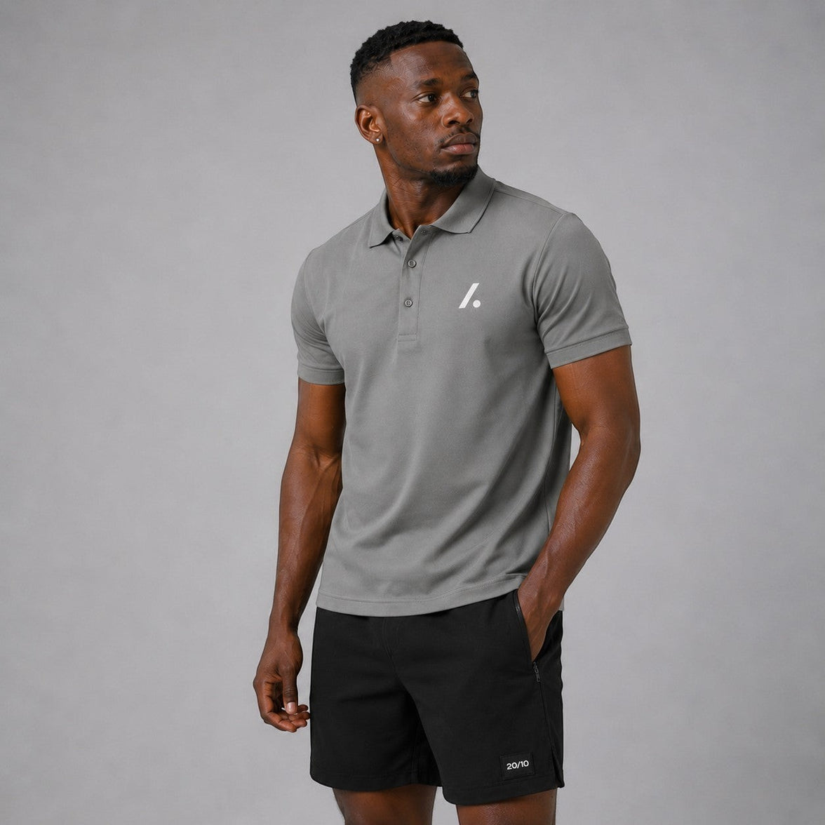 TwentyTenCollective Men's grey performance short sleeve polo shirt with white logo detail and classic collar.