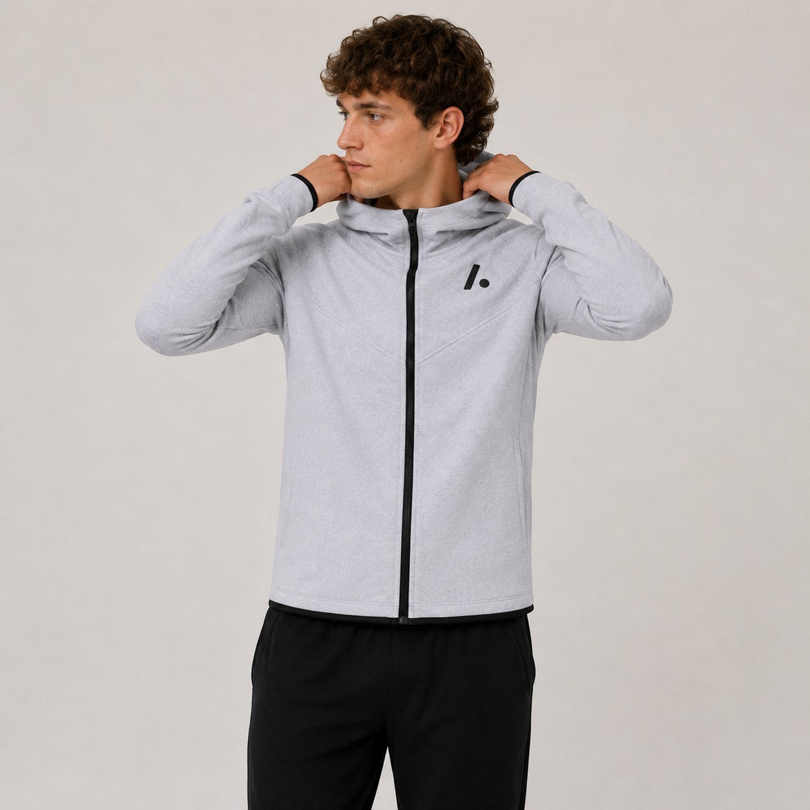 TwentyTenCollective light grey tech fleece full zip hoodie with black logo on chest and black trim.