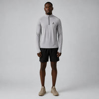 TwentyTenCollective Men's light grey quarter zip long sleeve athletic shirt with black logo detail.