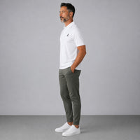 TwentyTenCollective Men's white performance polo shirt and olive green jogger pants set with a tapered fit.