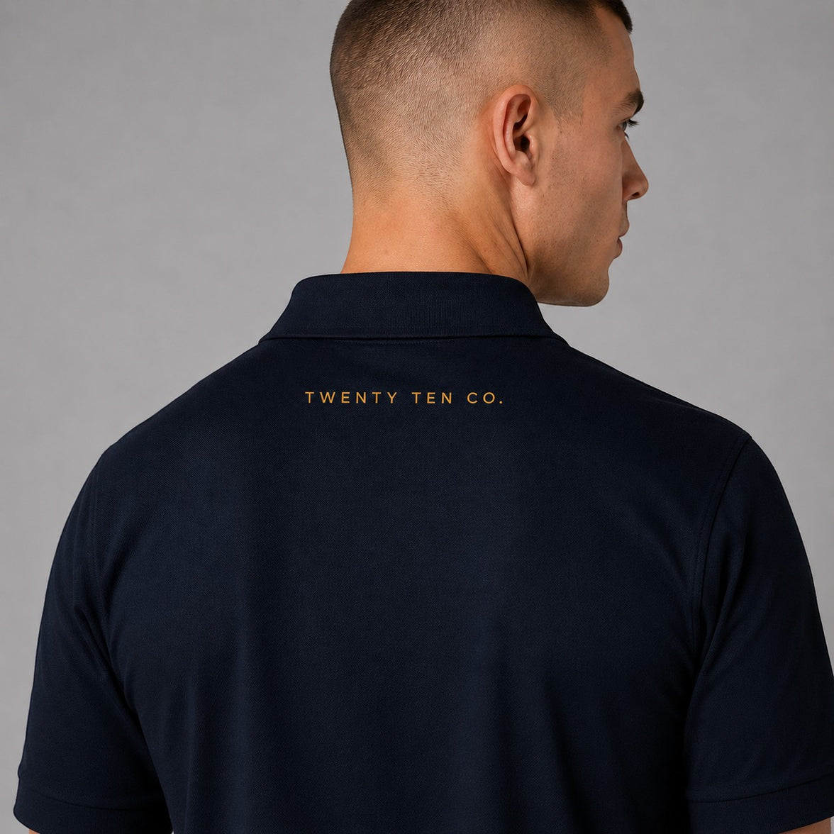 TwentyTenCollective classic navy blue short sleeve polo shirt with embroidered logo on back.