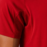 TwentyTenCollective red athletic shirt with mesh underarm panels for breathability and raglan sleeves for movement.