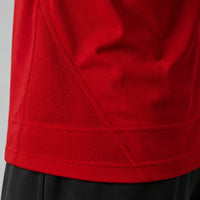 TwentyTenCollective red athletic shirt with mesh side panels and raglan sleeves for enhanced movement.