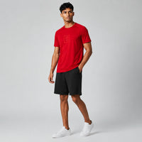 TwentyTenCollective Men's red athletic t-shirt with raglan sleeves and tonal chest logo. Lightweight, breathable fabric.
