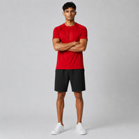 TwentyTenCollective men's red athletic t-shirt with raglan sleeves and tonal chest logo, paired with black shorts.