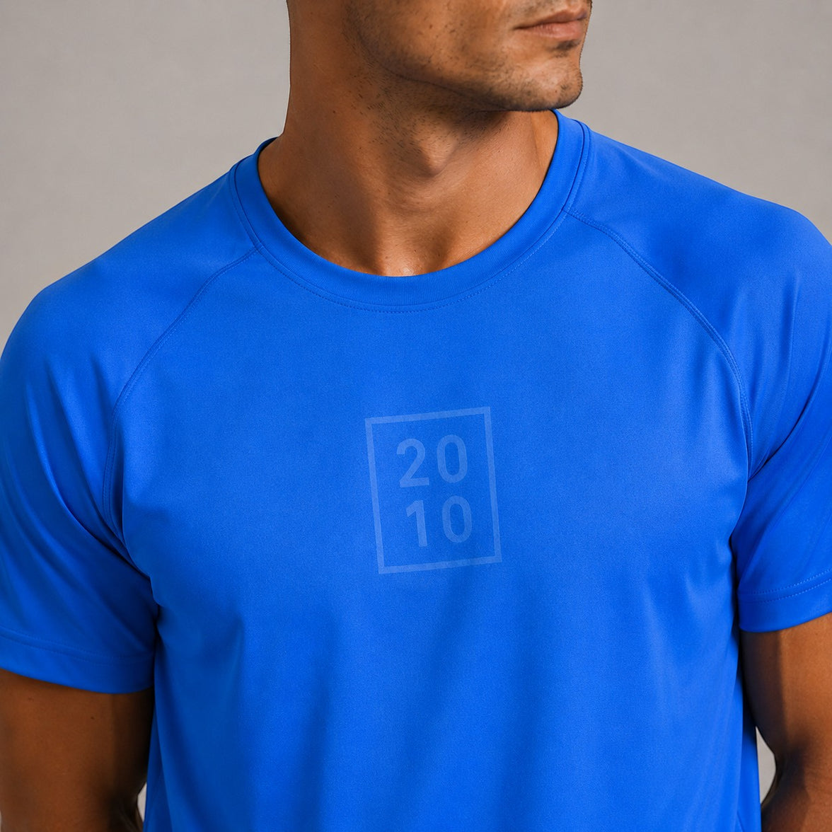 TwentyTenCollective men's sapphire blue athletic shirt with raglan sleeves and tonal chest logo.