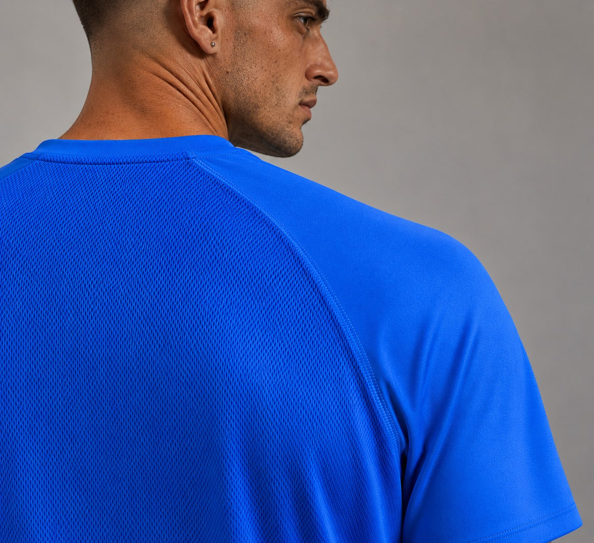 TwentyTenCollective Men's Sapphire Blue Athletic Shirt with raglan sleeves and mesh back panel.