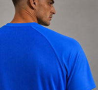 TwentyTenCollective Men's Sapphire Blue Athletic Shirt with raglan sleeves and mesh back panel.