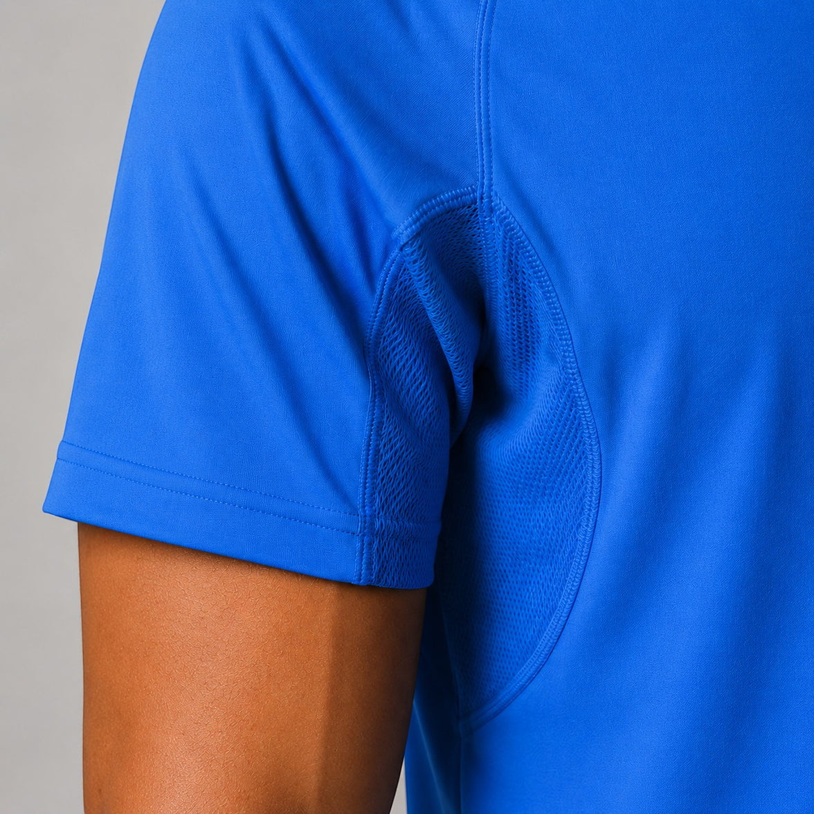 TwentyTenCollective sapphire blue athletic t-shirt with raglan sleeves and mesh ventilation panels.