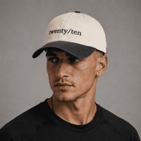 TwentyTenCollective cream and charcoal grey two-tone cotton baseball cap with embroidered logo and curved brim.