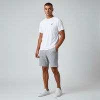 TwentyTenCollective white crew neck t-shirt with subtle logo and grey athletic shorts set for men.