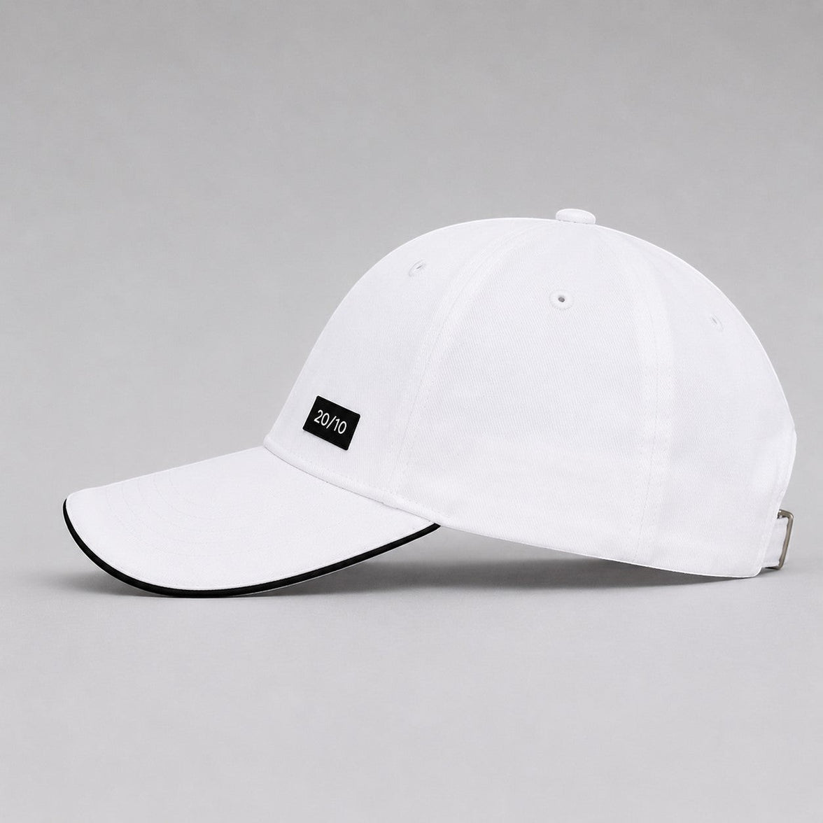 TwentyTenCollective white cotton baseball cap with black trim and a black label featuring "20/10" text.