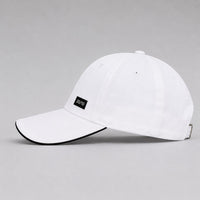 TwentyTenCollective white cotton baseball cap with black trim and a black label featuring "20/10" text.