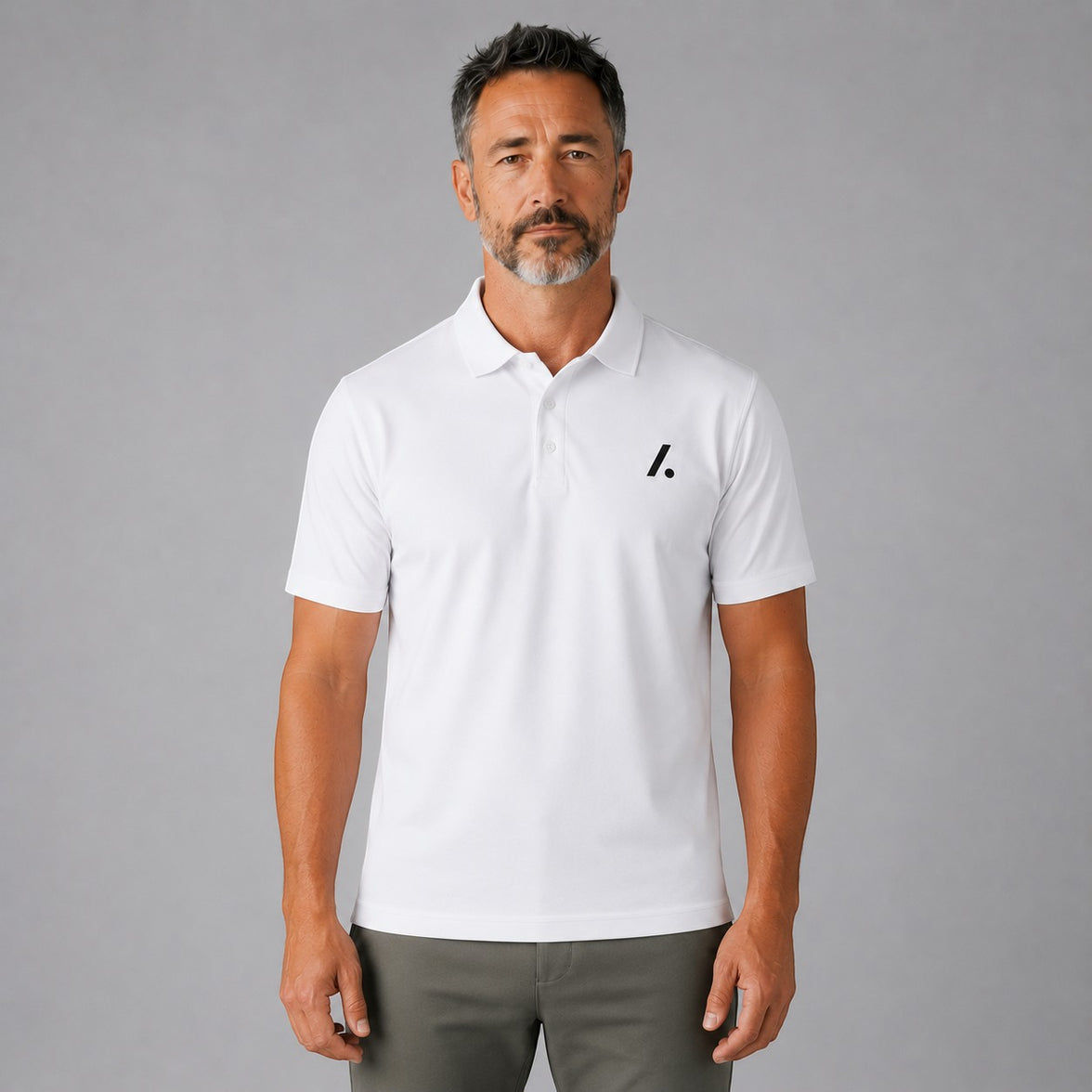 TwentyTenCollective white short-sleeve performance polo shirt with black logo on chest, paired with olive green joggers.