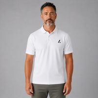 TwentyTenCollective white short-sleeve performance polo shirt with black logo on chest, paired with olive green joggers.