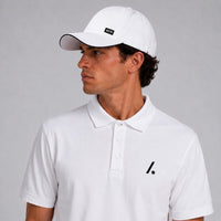 TwentyTenCollective white cotton blend polo shirt with a two-button placket and black logo accent.