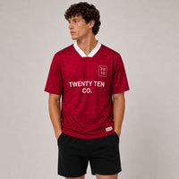 TwentyTenCo. Athletic Short Sleeve Jersey in red with geometric pattern, white crew neck, and contrasting trim.