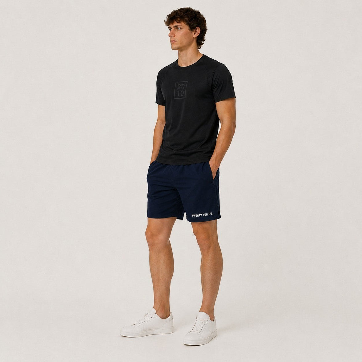 TwentyTenCo. navy blue athletic shorts for men, cotton blend, elastic waistband, drawstring, side pockets, zippered pocket, logo print.