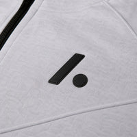 TwentyTenCollective light grey tech fleece hoodie with black logo detail and zipper.