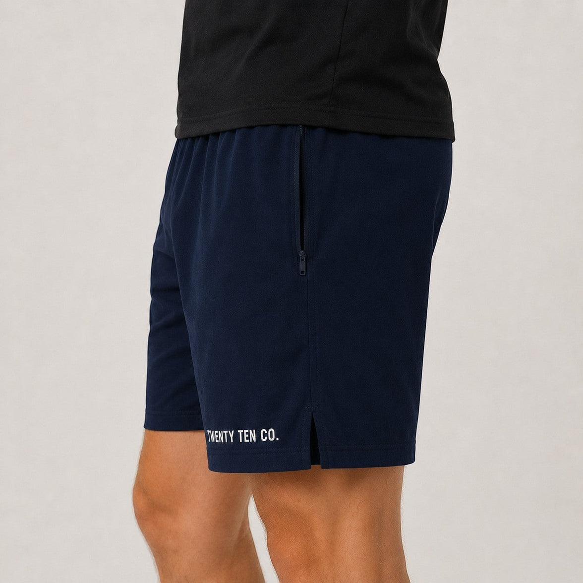 TwentyTenCo. navy blue athletic shorts for men, cotton blend with elastic waistband, drawstring, side pockets, and zippered pocket.