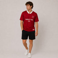 TwentyTenCo. Athletic Short Sleeve Jersey in vibrant red with a subtle geometric pattern and white trim. Features crew neck and minimalist logo.