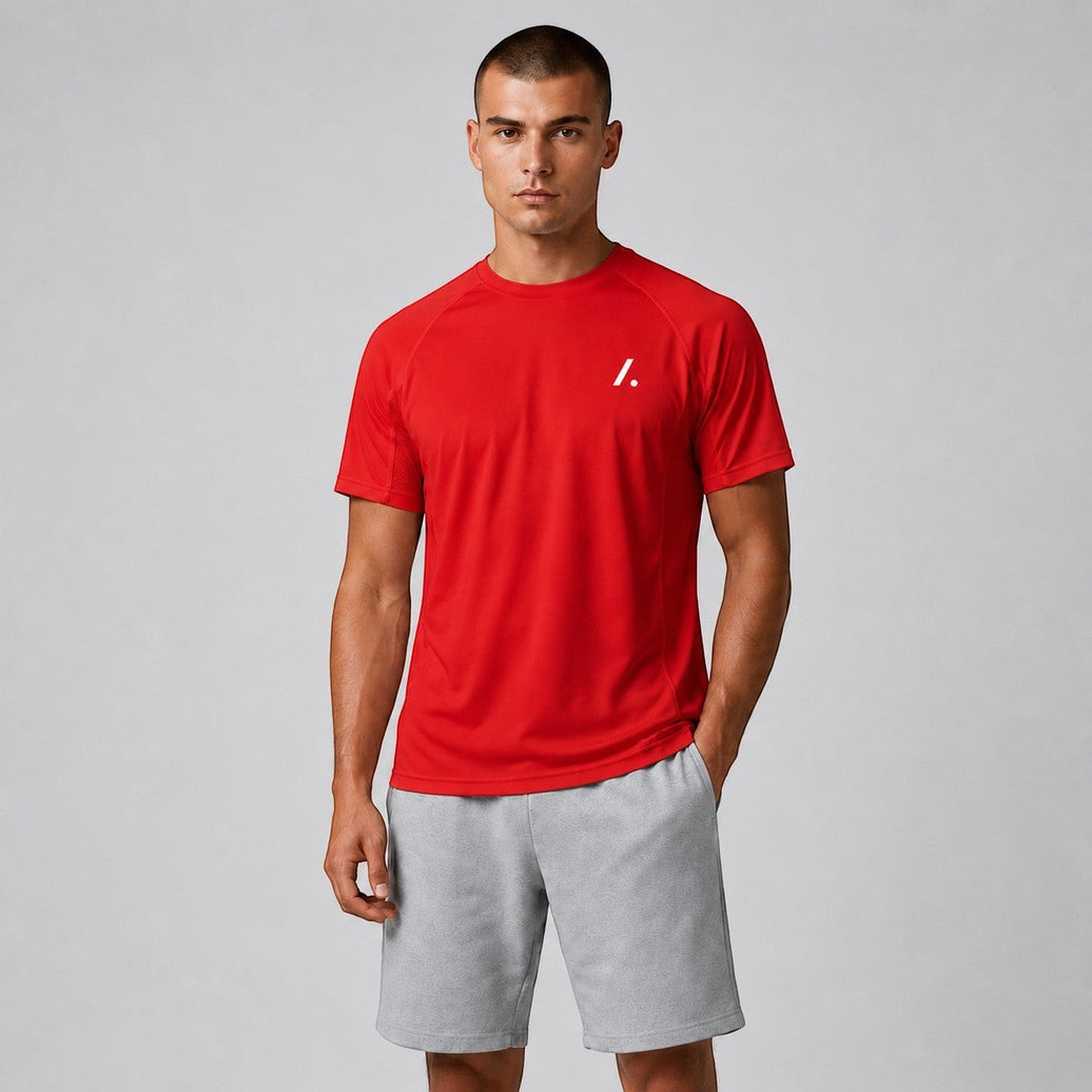 TwentyTenCollective red athletic t-shirt with white logo on chest, short sleeves, and breathable fabric.