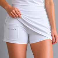 TwentyTenCollective white athletic tennis skort with built-in shorts and pocket